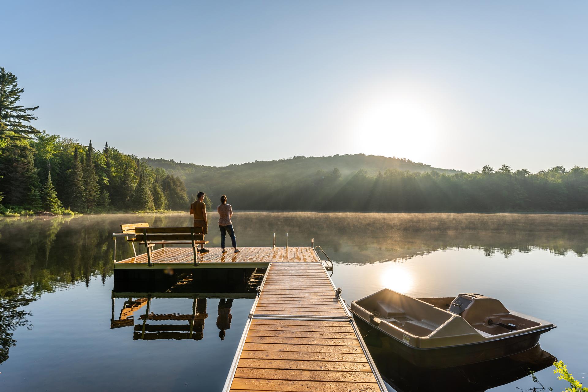 Couple on vacation by a lake.